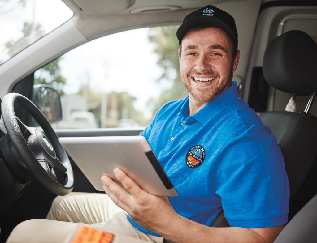 TECHNICIAN HOLDING TABLET